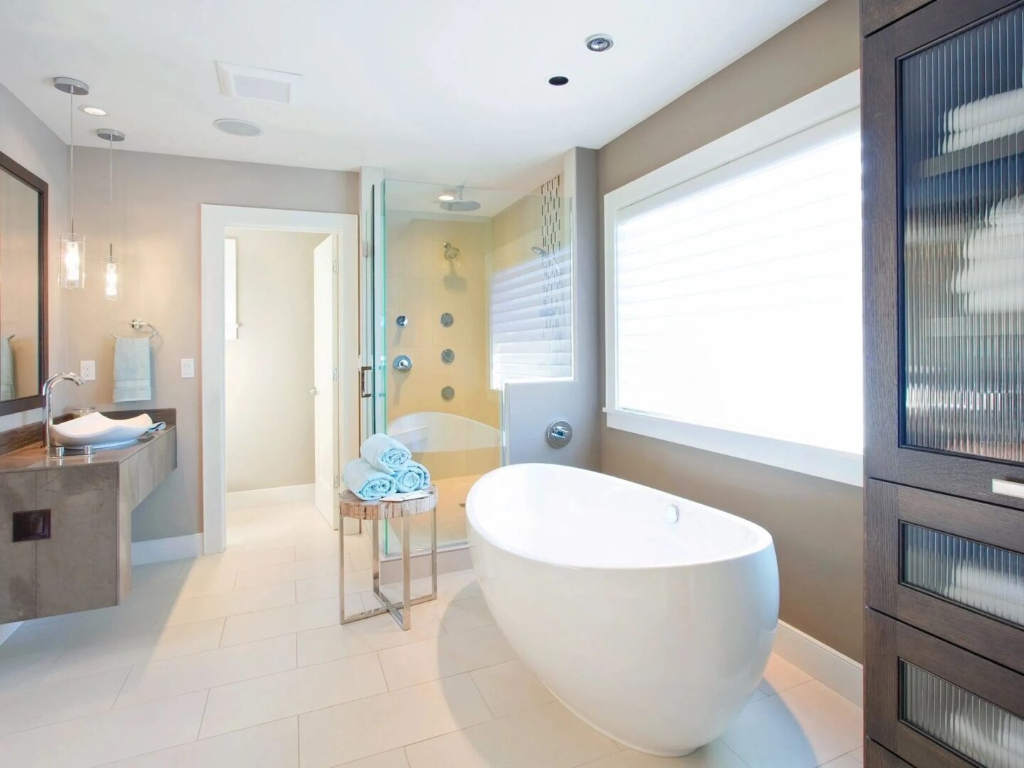 A bathroom with a large tub and shower.