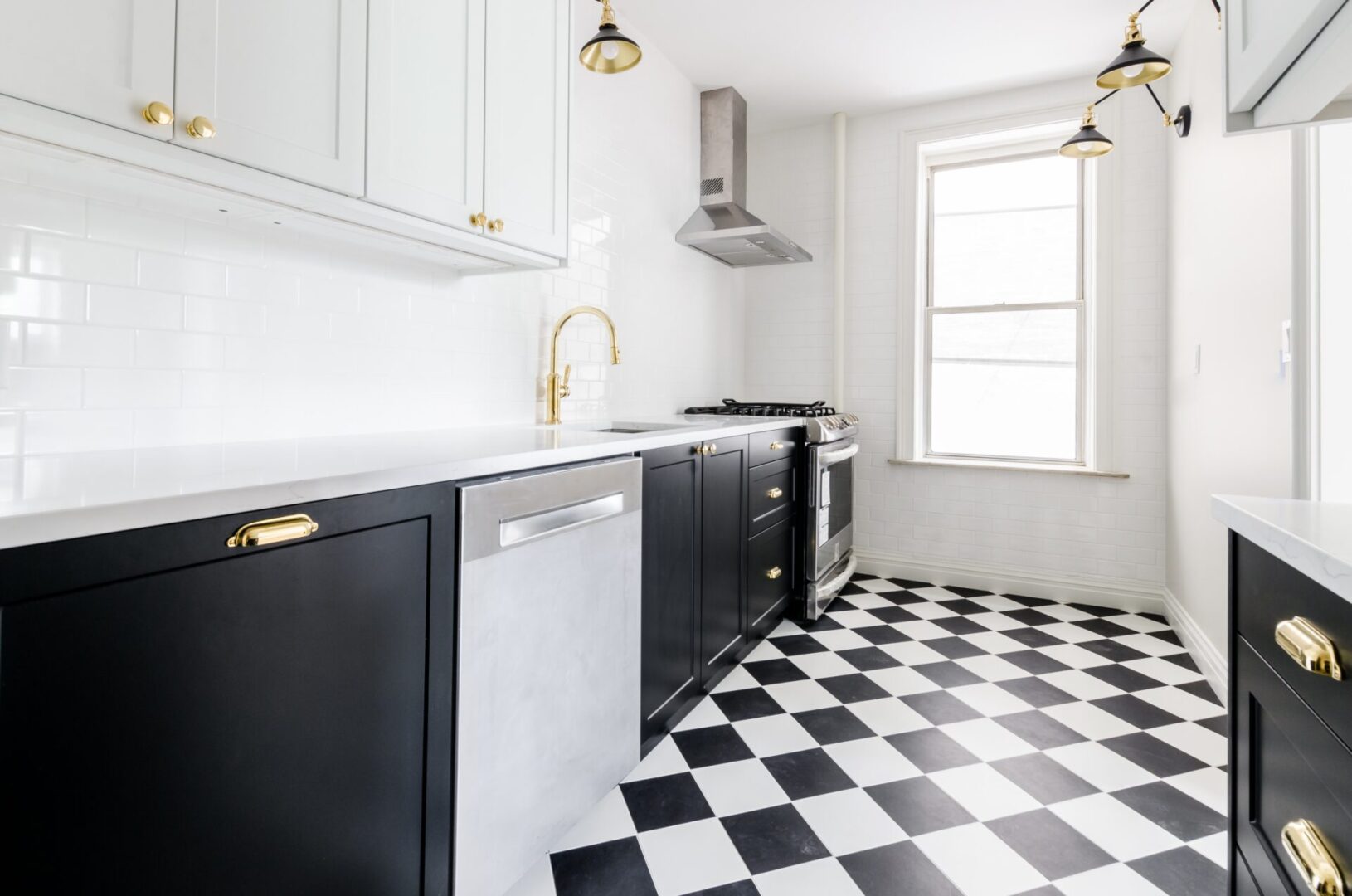 A kitchen with black and white checkered floor